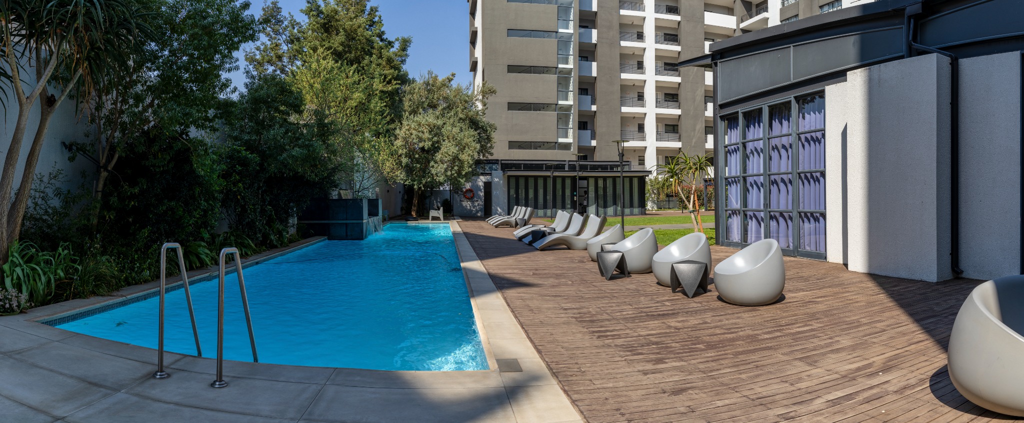 Sunlit swimming pool and deck