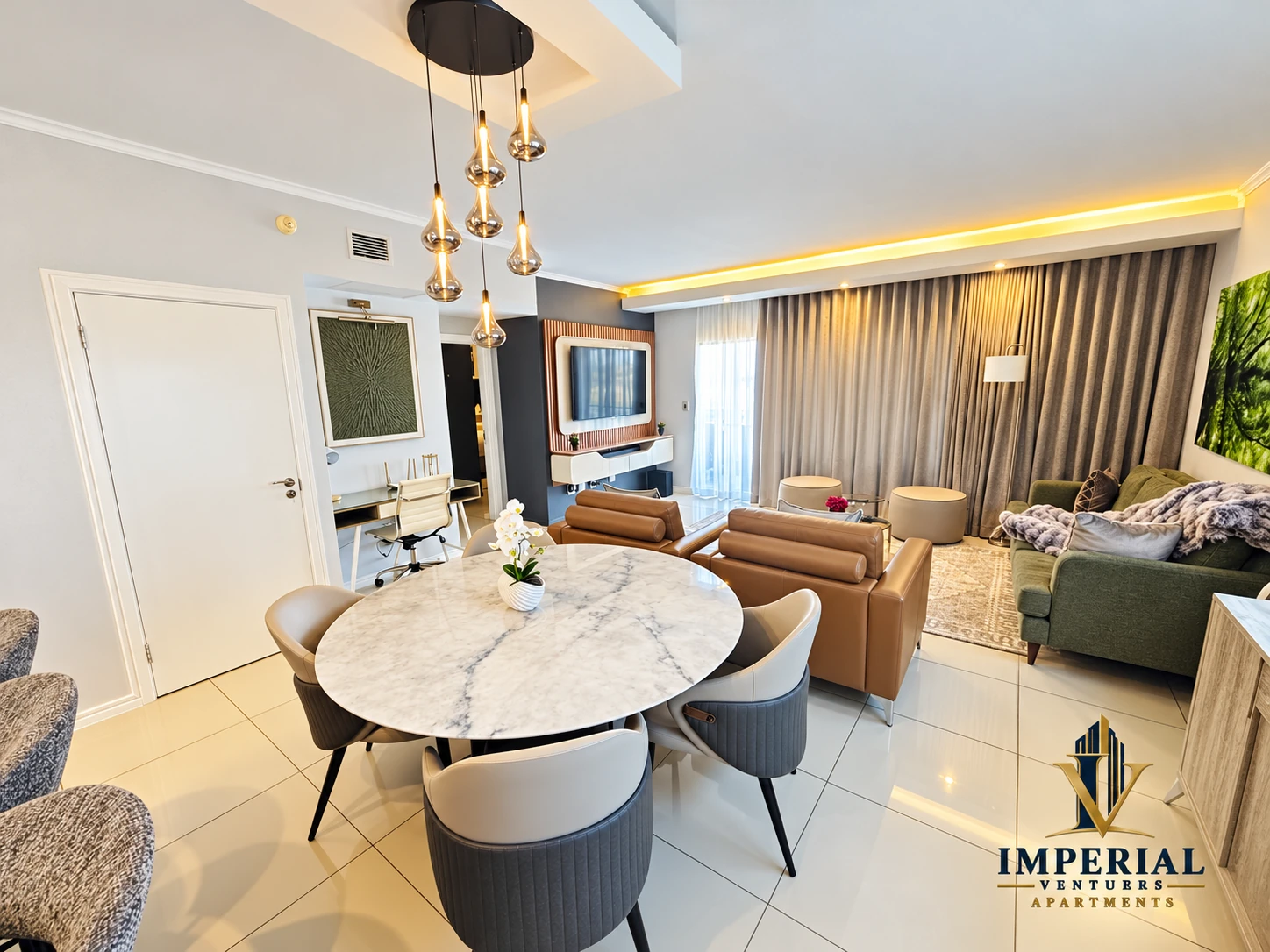 Open-plan dining and lounge with pendant lighting