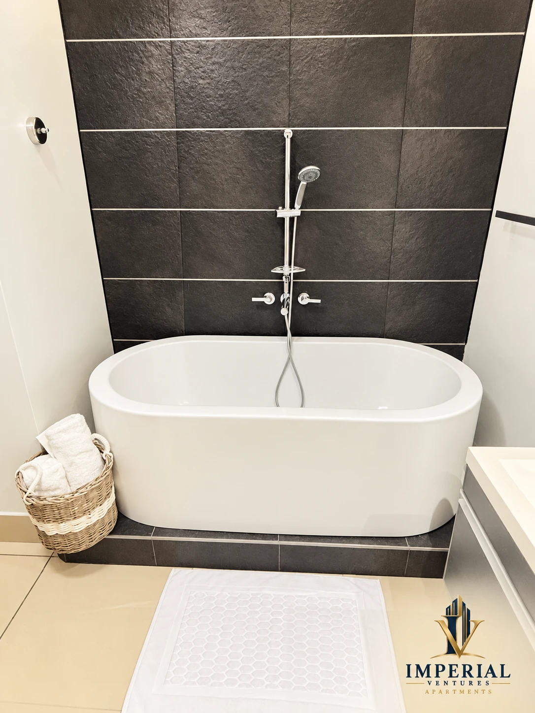 Freestanding bathtub with shower fitting